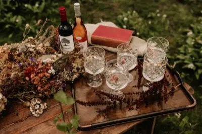 A tray of coloured cocktails and vintage glassware