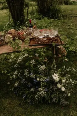 Florals spilling from the woodland table