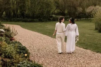 Nadia and Poppy walking the gravel path together